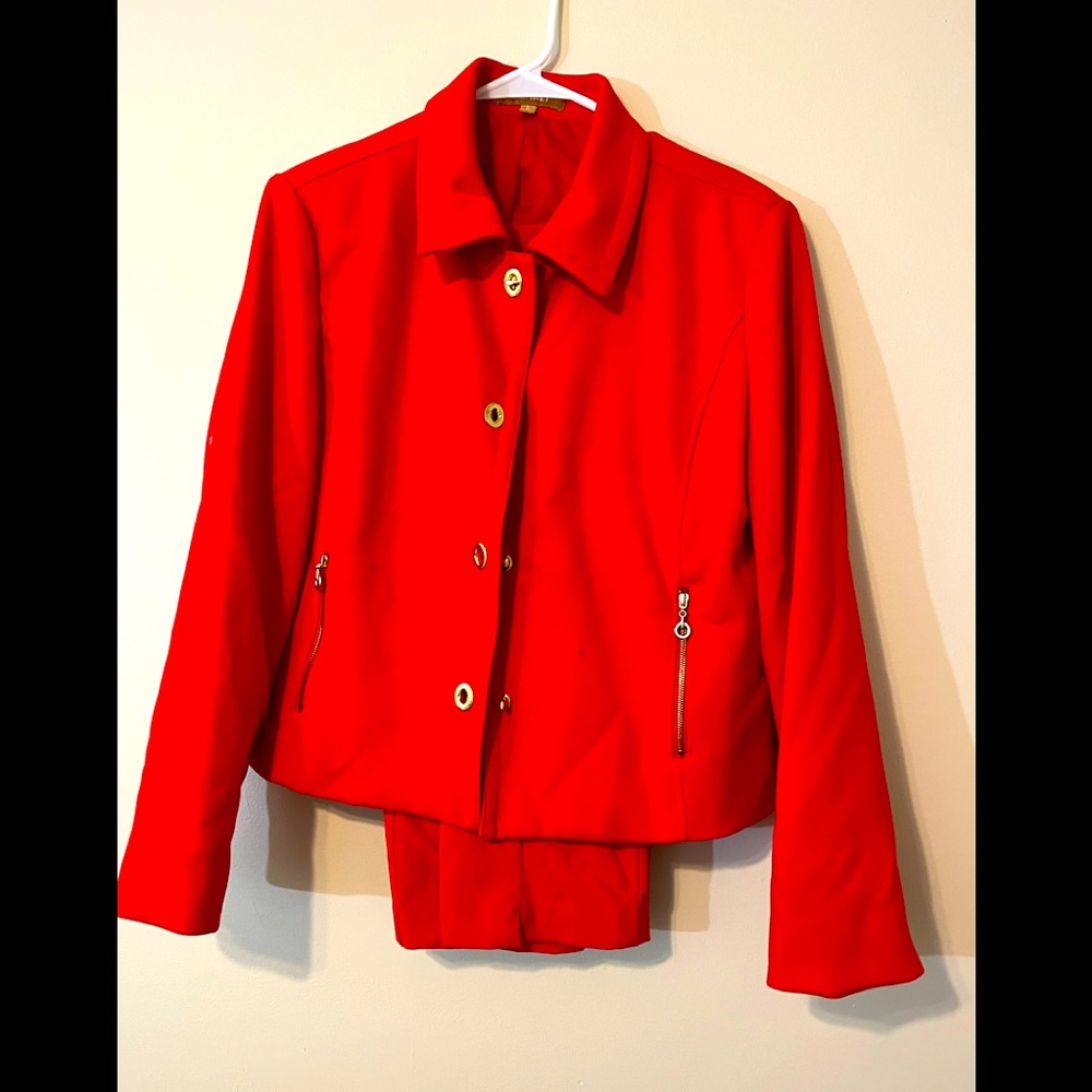 Red pantsuit with gold trim.